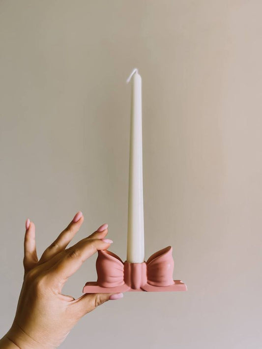 Pillar candle with bow holder