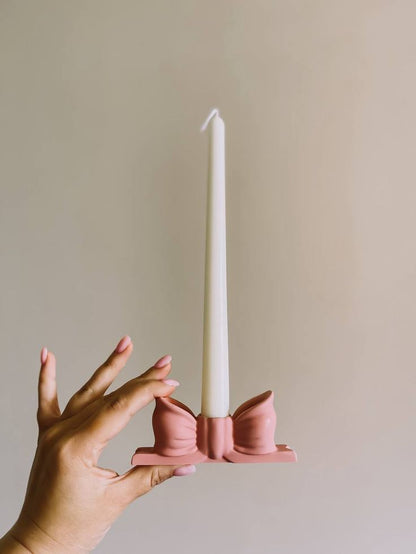 Pillar candle with bow holder